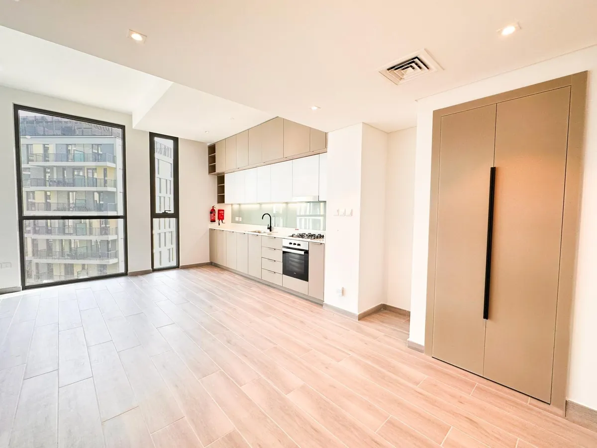 Living room with full-height windows in a Noor apartment, photo